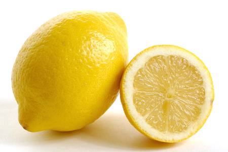 two lemons with a sudden? white backgroundの写真素材