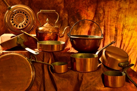 different containers in brass draped in the background colorsの写真素材