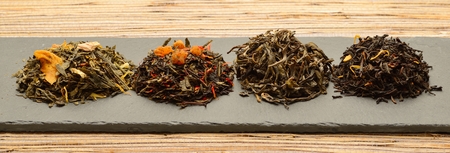 Photo of various kinds of tea Placed on slabs of slateの写真素材