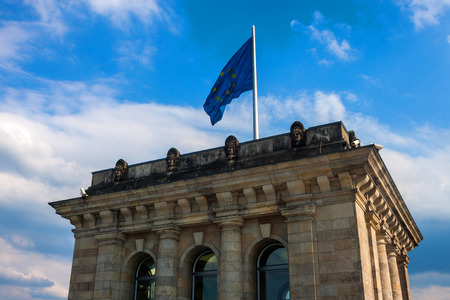 Tower with European union flag on the top of Reichstag building, Berlin, Germanyの写真素材