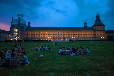 BONN, GERMANY - JULY 22: Students of University in Bonn sit in front of main building of University on July 22, 2013 in Bonn, Germany. University Bonn hat 31,000 students.のeditorial素材