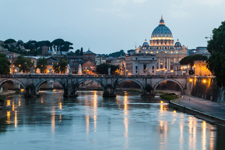 Angel bridge and St. Peter's Basilica copula in Rome, Italy during sunsetのeditorial素材