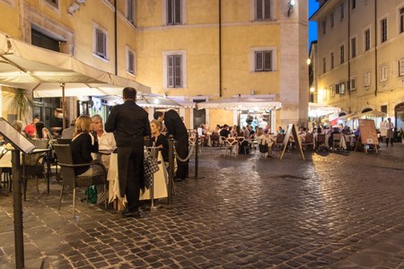 ROME - JUNE 24: People eat in street restaurants on June 24, 2014 in Rome, Italy. According to Euromonitor, Rome is the 3rd most visited city in Europe (5.5m international tourist arrivals 2009).のeditorial素材