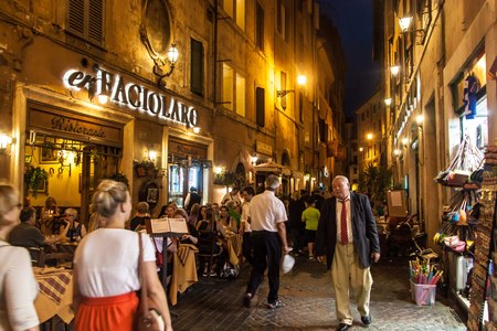 ROME - JUNE 24: People eat in street restaurants on June 24, 2014 in Rome, Italy. According to Euromonitor, Rome is the 3rd most visited city in Europe (5.5m international tourist arrivals 2009).のeditorial素材