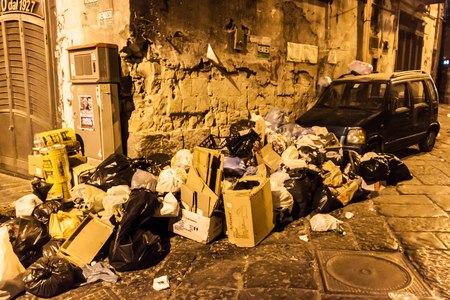 NAPLES, ITALY- JUNE 26, 2014: Garbage dumped at the side of the street in Naples, Italy. Garbage collection remains a recurrent problem in southern Italy due to strikes and corruption.のeditorial素材