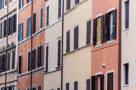 Facades and windows of old traditional houses in the center of Rome, Italyの写真素材