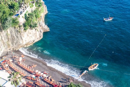 POSITANO, ITALY - JUNE 28, 2014: Bagni d'Arienzo beach in village Positano, Italy. Positano is famous summer resort on Amalfi coast surrounded by cliffs and coastal sceneryのeditorial素材