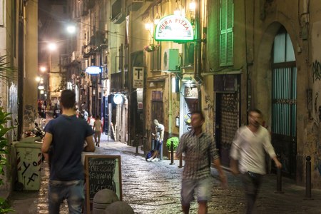 NAPLES, ITALY- JUNE 30, 2014: Night view of a street in historic center of Naples, Italy. Naples historic city center is the largest in Europe.のeditorial素材