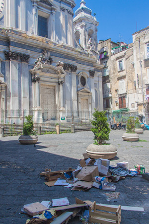 NAPLES, ITALY- JULY 1, 2014: Garbage dumped at the side of the street in Naples, Italy. Garbage collection remains a recurrent problem in southern Italy due to strikes and corruption.のeditorial素材