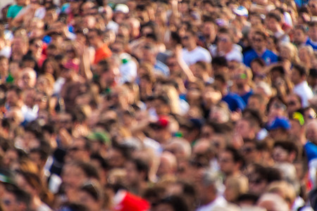 Crowd of football fans watching the match in the streets. Out of focus.のeditorial素材