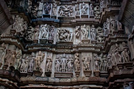 Detail of an erotic carving on a temple in Khajuraho, Madhya Pradesh, India.のeditorial素材