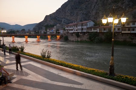 AMASYA, TURKEY - JULY 22: Unidentified locals and tourists walk along Yesilirmak river on July 22, 2011 in Amasya, Turkey. Amasya is a city in northern Turkey. Population of the city is 99 905.のeditorial素材
