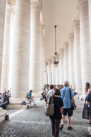ROME, ITALY - JUNE 25: Tourists visit St. Peter's Square in Vatican on June 25, 2014. Saint Peter's Square is among most popular pilgrimage sites for Roman Catholics.のeditorial素材