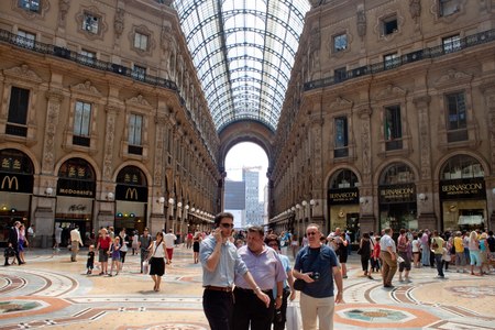 MILAN, ITALY - JULY 19, 2010: Tourists and shoppers walk inside the Galleria Vittorio Emanuele II, one of the world's oldest shopping malls, built between 1865 and 1877のeditorial素材
