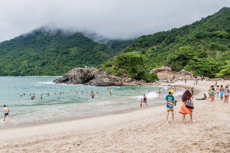 TRINDADE, BRAZIL - JANUARY 31, 2015: People enjoy Praia Meio beach in Trindade village near Paraty, Rio de Janeiro state, Brazil.のeditorial素材