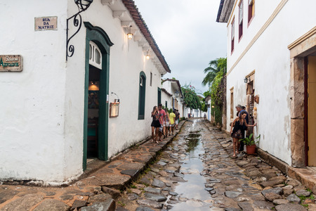 PARATY, BRAZIL - JANUARY 30, 2015: People walk in a narrow street an old colonial town Paraty, Brazilのeditorial素材