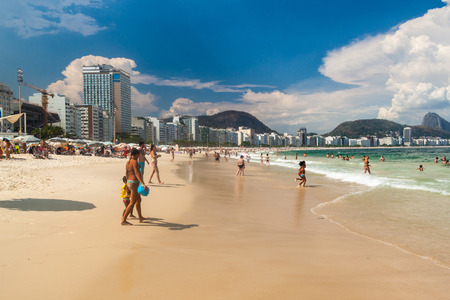 RIO DE JANEIRO, BRAZIL - JANUARY 27, 2015: People enjoy the famous beach Copacabana in Rio de Janeiro.のeditorial素材