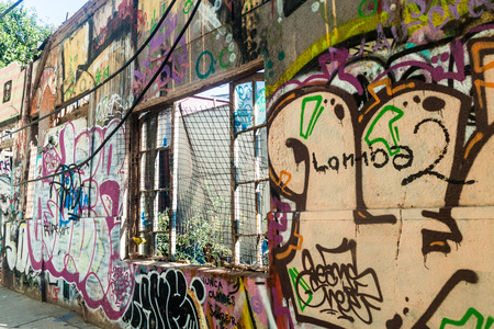VALPARAISO, CHILE - MARCH 29, 2015: House covered under colorful graffiti in Valparaiso, Chileのeditorial素材