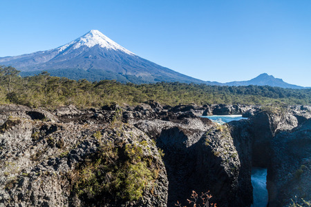 Saltos del Petrohue waterfalls and volcano Osorno in National Park Vicente Perez Rosales, Chileのeditorial素材