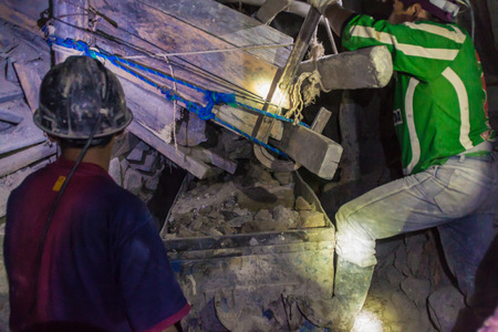POTOSI, BOLIVIA - APRIL 20, 2015: Bolivian miners work inside Cerro Rico mine in Potosi, Bolivia.のeditorial素材