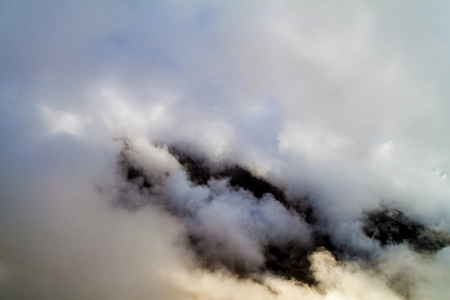 Mountain covered by clouds