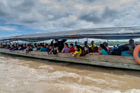 NAPO, ECUADOR - JULY 7, 2015: Passengers of a boat traveling a river Napo stretch Coca-Nuevo Rocafuerte.のeditorial素材