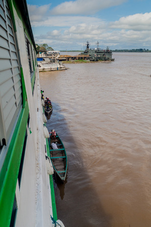 TABATINGA, BRAZIL - JUNE 22, 2015: Loading and unloading of goods to the boat Diamante on river Amazon in Tabatinga, Brazil.のeditorial素材