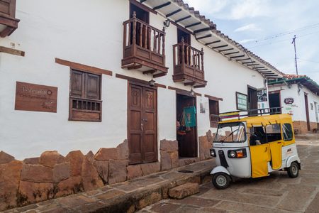 BARICHARA, COLOMBIA - SEPTEMBER 17, 2015: Mototaxi (tuk tuk) and old colonial houses in Barichara village, Colombiaのeditorial素材