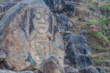 Figure carved in a rock located at El Chaquira site near San Agustin, Colombia
