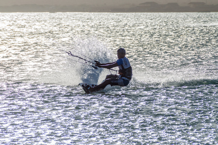 CABO DE LA VELA, COLOMBIA - AUGUST 23, 2015: Kitesurfer in a sea near village Cabo de la Vela located on La Guajira peninsula.のeditorial素材