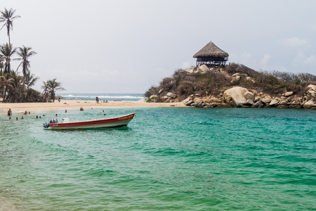 TAYRONA, COLOMBIA - AUGUST 26, 2015: People enjoy beautiful waters of Carribean sea in Tayrona National Park, Colombiaのeditorial素材