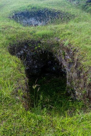 Entrance to the ancient tomb located in El Aguacate site in Tierradentro, Colombiaの写真素材