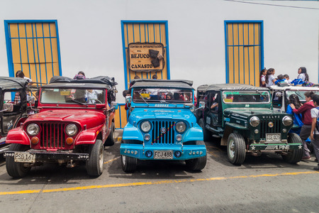 FILANDIA, COLOMBIA - SEPTEMBER 7, 2015: Jeeps are an important part of rural transportation in Colombia. These are for children travelling from the school.のeditorial素材