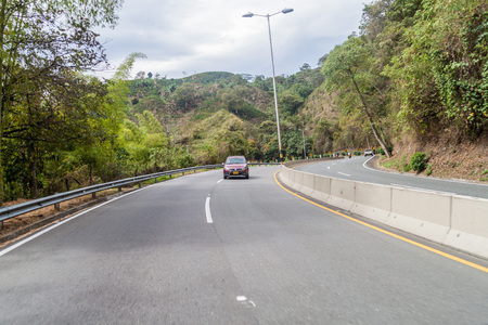 MANIZALES, COLOMBIA - SEPTEMBER 6, 2105: Traffic on Autopista del Cafe (Coffee Highway) connecting important coffee production areas in Colombia.のeditorial素材