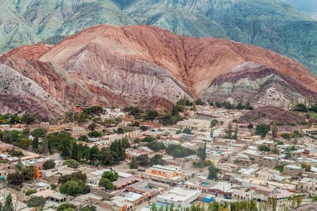 Cerro del los Siete Colores (Hill of Seven Colors) over Purmamarca village (Quebrada de Humahuaca valley), Argentinaの写真素材