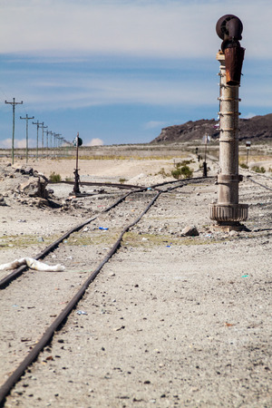 Railway track leading from Bolivia to Chile in a small village Julaca, Bolivia. This village is located in a desert of southwestern Bolivia near salt plains of Uyuni.の写真素材