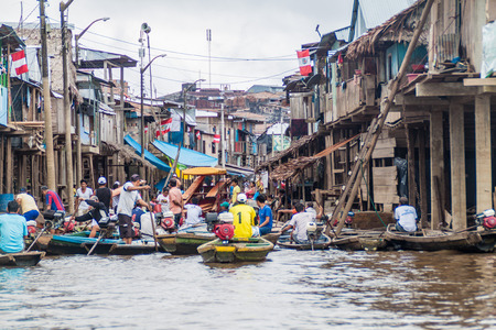 IQUITOS, PERU - JULY 18, 2015: View of partially floating shantytown in Belen neigbohood of Iquitos,...