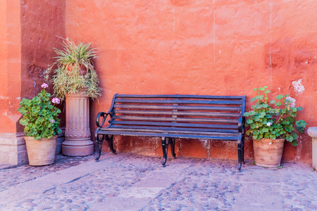Bench and flowers in Santa Catalina monastery in Arequipa, Peruの写真素材