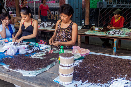 IQUITOS, PERU - JUNE 18, 2015: Cigarettes sellers on Belen Market in Iquitosのeditorial素材