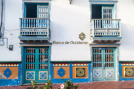 GUATAPE, COLOMBIA - SEPTEMBER 2, 2015: Colorful decorated building of Banco de Occidente bank in Guatape village, Colombiaのeditorial素材
