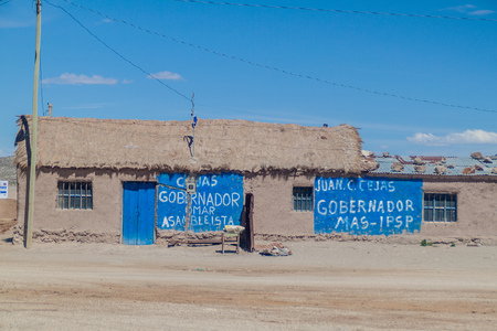 JULACA, BOLIVIA - APRIL 16, 2015: Election posters on a house in a small village Julaca, Bolivia. This village is located in a desert of southwestern Bolivia near salt plains of Uyuni.のeditorial素材