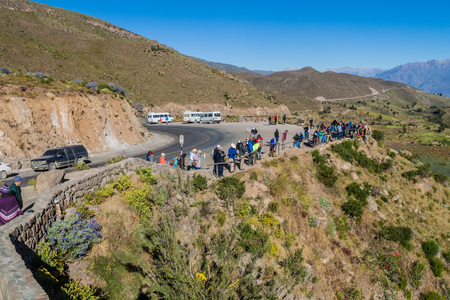 CABANACONDE, PERU - MAY 27, 2015: Unidentified tourists at the Cruz Del Condor viewpoint.