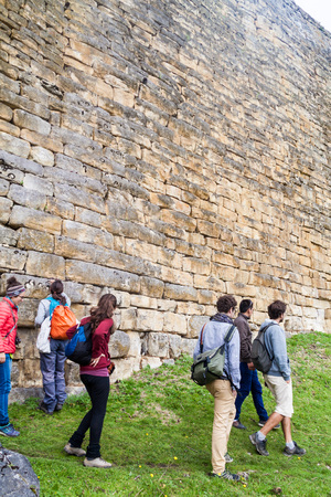 KUELAP, PERU - JUNE 12, 2015: Group of tourists visits Kuelap, ruined citadel city of Chachapoyas cloud forest culture in mountains of northern Peru.のeditorial素材