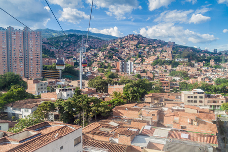 Medellin cable car system connects poor neighborhoods in the hills around the city.のeditorial素材
