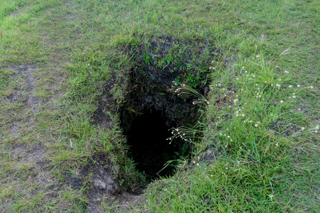Entrance to the ancient tomb located in El Aguacate site in Tierradentro, Colombiaの写真素材