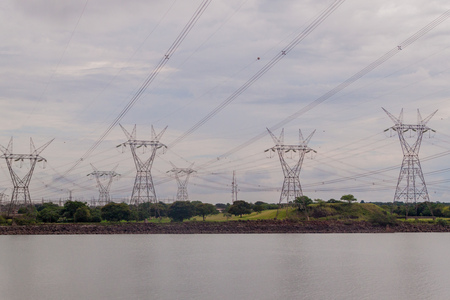 Power lines next to Itaipu dam on river Parana on the border of Brazil and Paraguayの写真素材