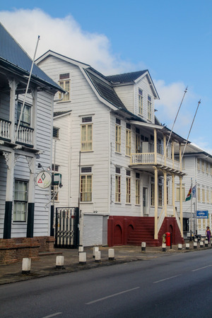PARAMARIBO, SURINAME - AUGUST 6, 2015: Street with old colonial buildings in Paramaribo, capital of Suriname.のeditorial素材