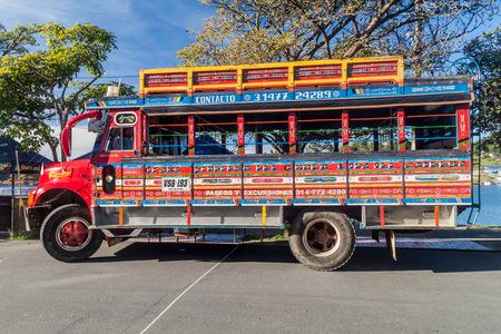 GUATAPE, COLOMBIA  - SEPTEMBER 2, 2015: Colorful chiva buses are important part of rural public transport in Colombia.のeditorial素材