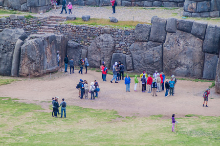 SACSAYWAMAN, PERU - MAY 24, 2015: Tourists visit  Inca's ruins of Sacsaywaman near Cuzco, Peru.のeditorial素材