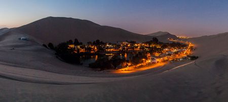 Evening view of illuminated desert oasis Huacachina near Ica, Peruの写真素材